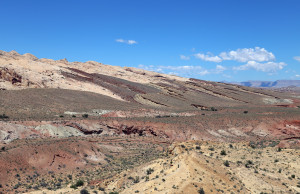 Layers of stone are different colors as they are washed away.