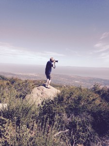 Steve precariously taking picture from overlook of Santa Barbara on ridge road