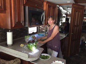 Joan preparing dinner in RV